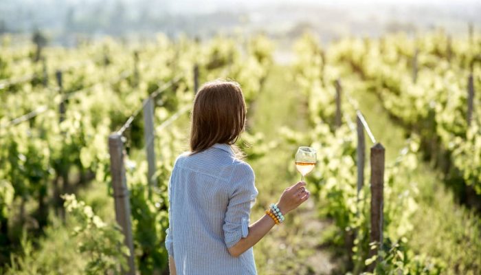 woman-tasting-wine-outdoors-2023-11-27-05-23-49-utc(1)(1)(2)